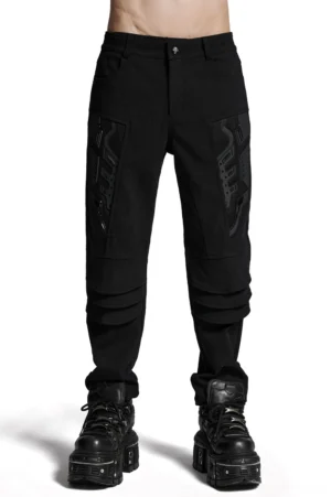 Black gothic armor cargo pants front view on male model with 3D thigh patches and layered knee detailing