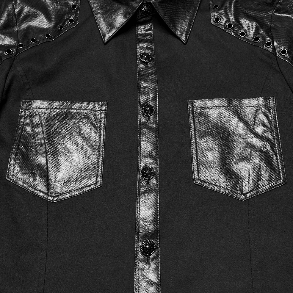 Close-up detail of black gothic shirt front featuring decorative skull-embellazoned buttons and structured leather chest pockets
