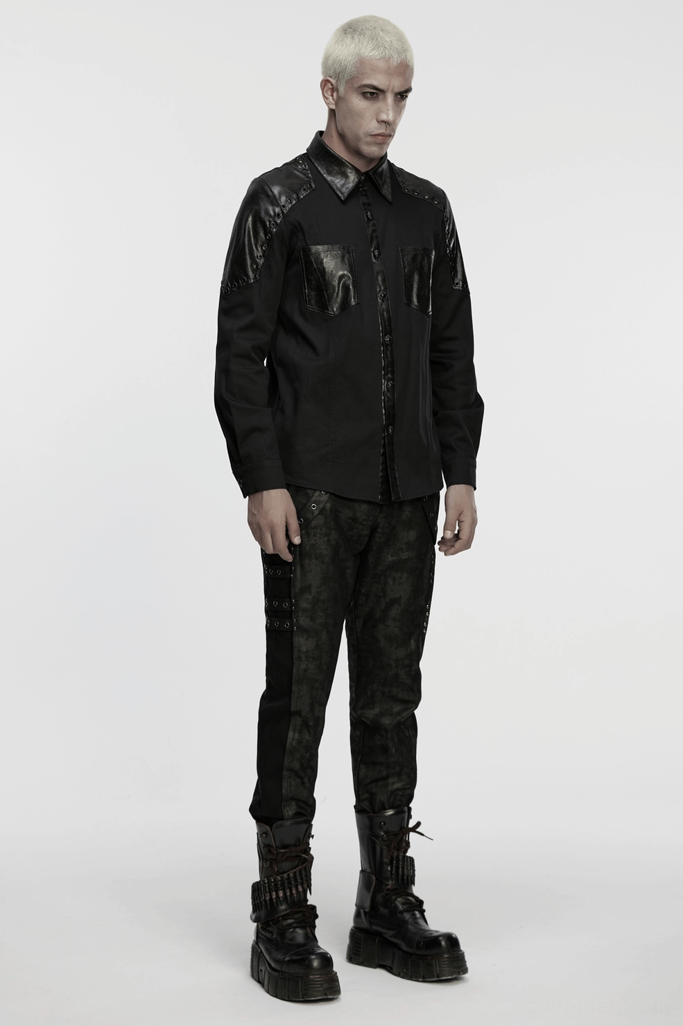 Black gothic twill shirt with leather armor shoulders displaying structural design, metal studs, and architectural gothic aesthetic elements