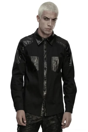 Black gothic twill shirt with armor leather shoulders and metal studs worn by platinum blonde male model, front full-body view on white studio background