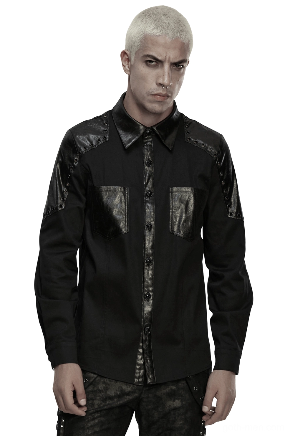 Black gothic twill shirt with armor leather shoulders and metal studs worn by platinum blonde male model, front full-body view on white studio background