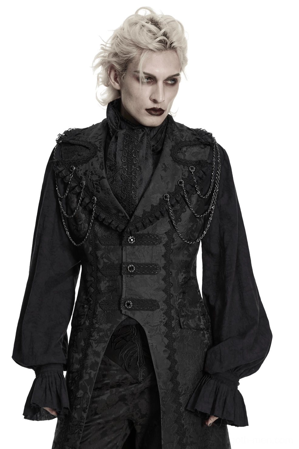 Male model in gothic formal attire featuring black jacquard ascot tie with chain decorations and ruffled cuffs, front full view