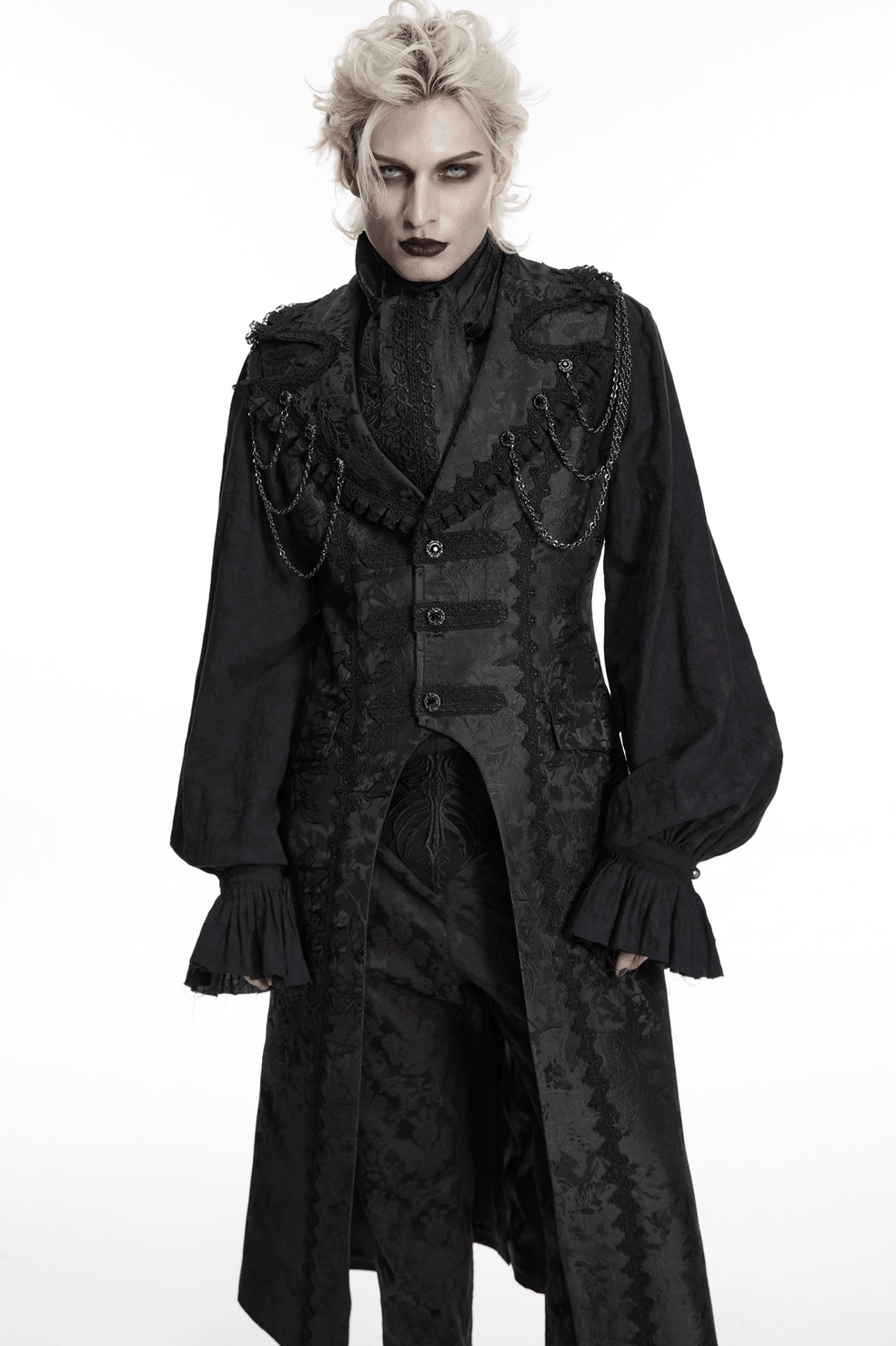 Male model in complete gothic formal outfit featuring black jacquard ascot tie with tailcoat and chain accessories, front body view