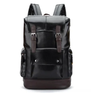 Black gothic utility backpack front view showing dual buckle straps, brown leather accents, and structured silhouette
