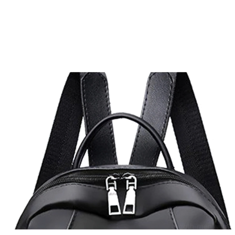 Close-up of black gothic backpack zipper and shoulder strap showing dual metal sliders and padded mesh lining