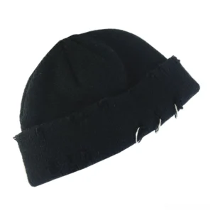 Black gothic knit beanie with distressed holes and metal ring hardware, rolled cuff detail