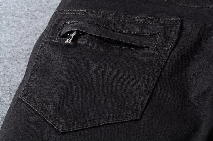 Black gothic biker jeans sizing reference - flat lay product display