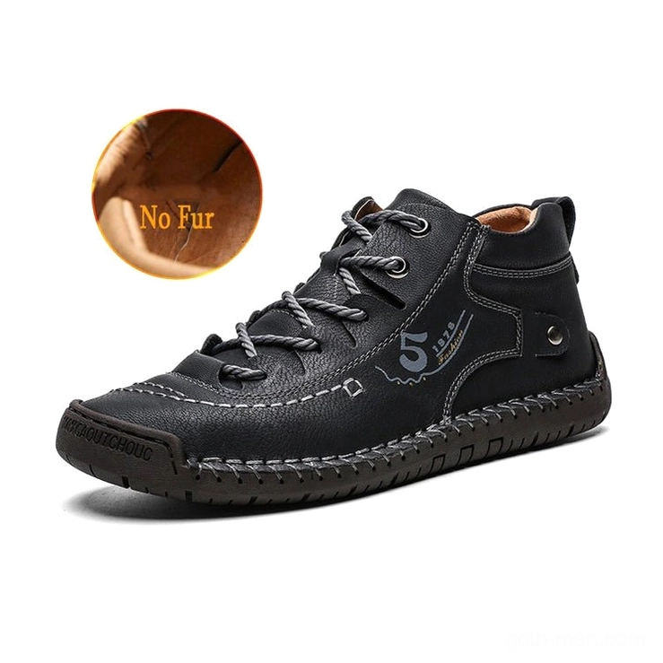 Black gothic ankle boots without plush lining, showing minimalist stitched leather design for pure goth aesthetic