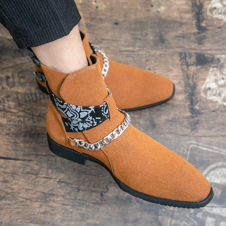 Black gothic ankle boots studio shot emphasizing matte suede texture and decorative hardware craftsmanship details