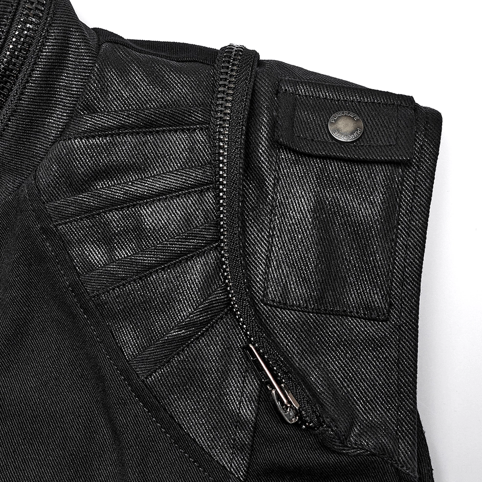 Close-up of black gothic buckle vest shoulder and pocket area showing pleated leather panel, zippered pocket, and metal snap button