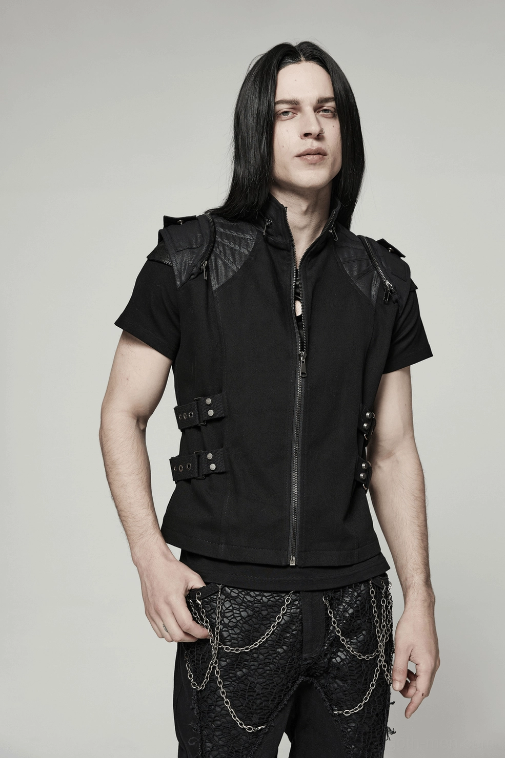 Styled flat lay of black gothic buckle vest with alternative fashion accessories and gothic aesthetic elements
