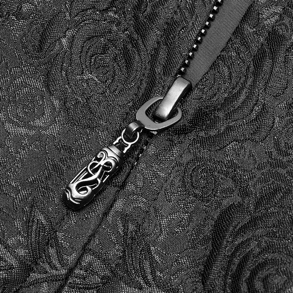 Close-up macro detail of ornate rose jacquard woven texture with decorative metal zipper hardware