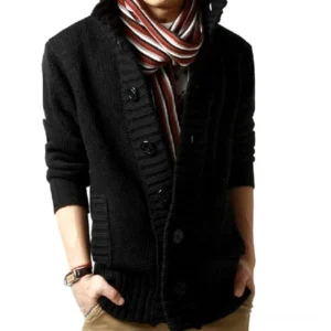 Black extra coarse wool gothic cardigan with mandarin collar and button front closure, styled on male model with striped scarf, studio front view