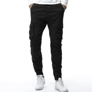 Black gothic cargo jogger pants front view worn by male model with multiple cargo pockets and tapered cuffs