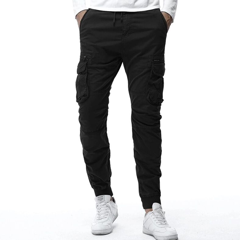Black gothic cargo jogger pants front view worn by male model with multiple cargo pockets and tapered cuffs
