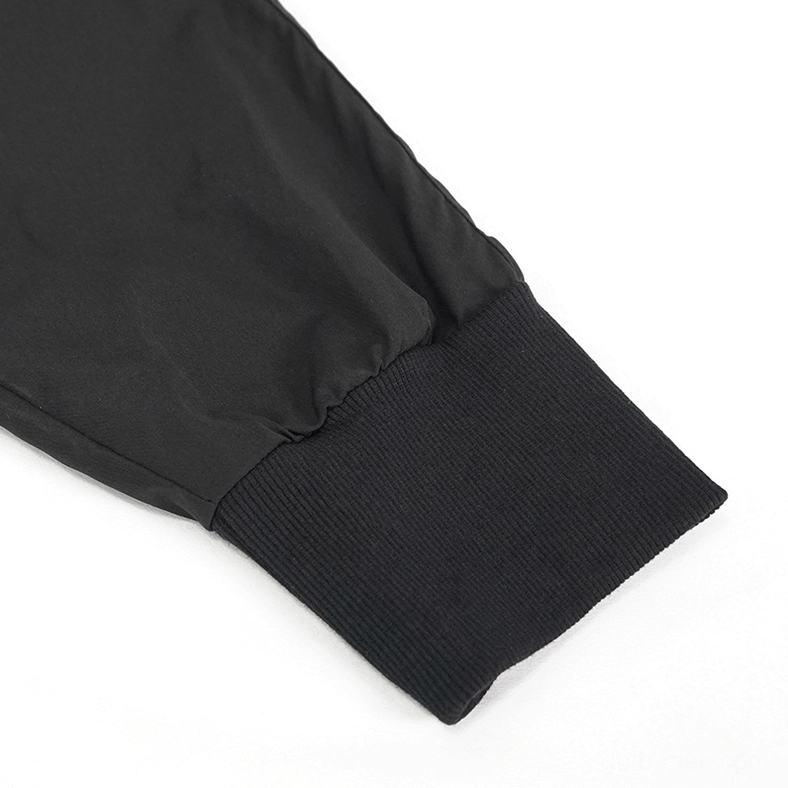 Close-up detail of black gothic cargo pants jogger cuff with ribbed elastic and black fabric