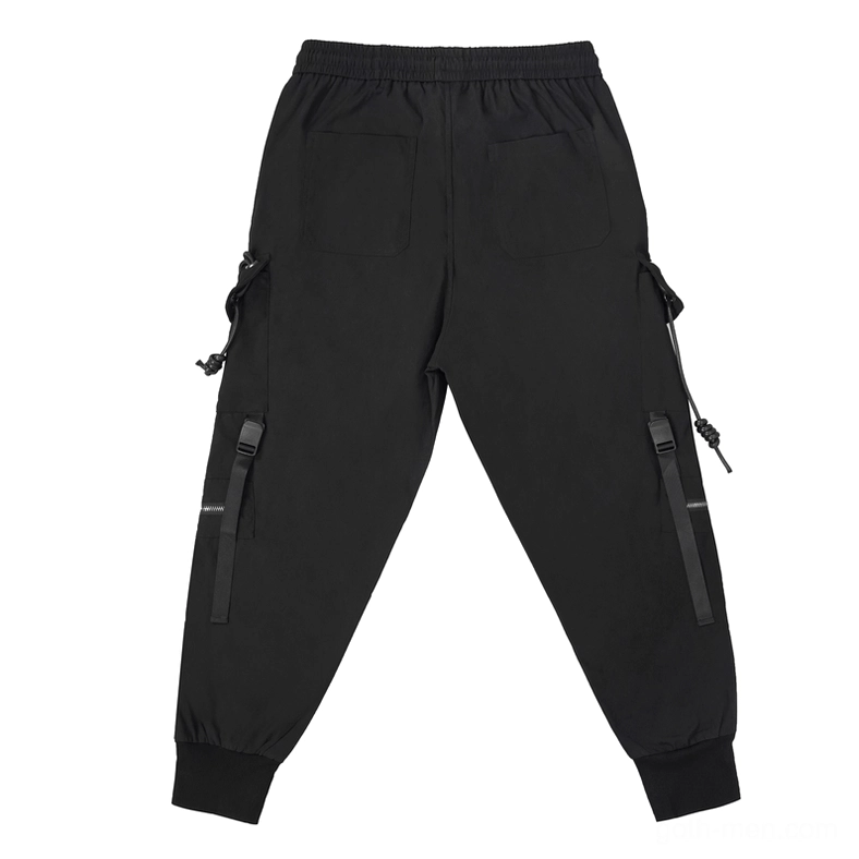 Rear flat lay of black gothic cargo pants displaying back patch pockets, side tactical straps, and pentagram hardware placement