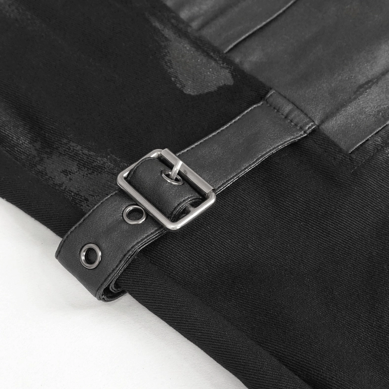 Close-up detail of black gothic cargo pants metal square buckle on leather strap with coated fabric