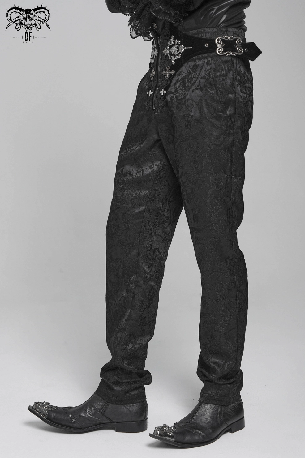 Black gothic cargo pants rear view on model showing lace-up waistband and tapered leg proportions