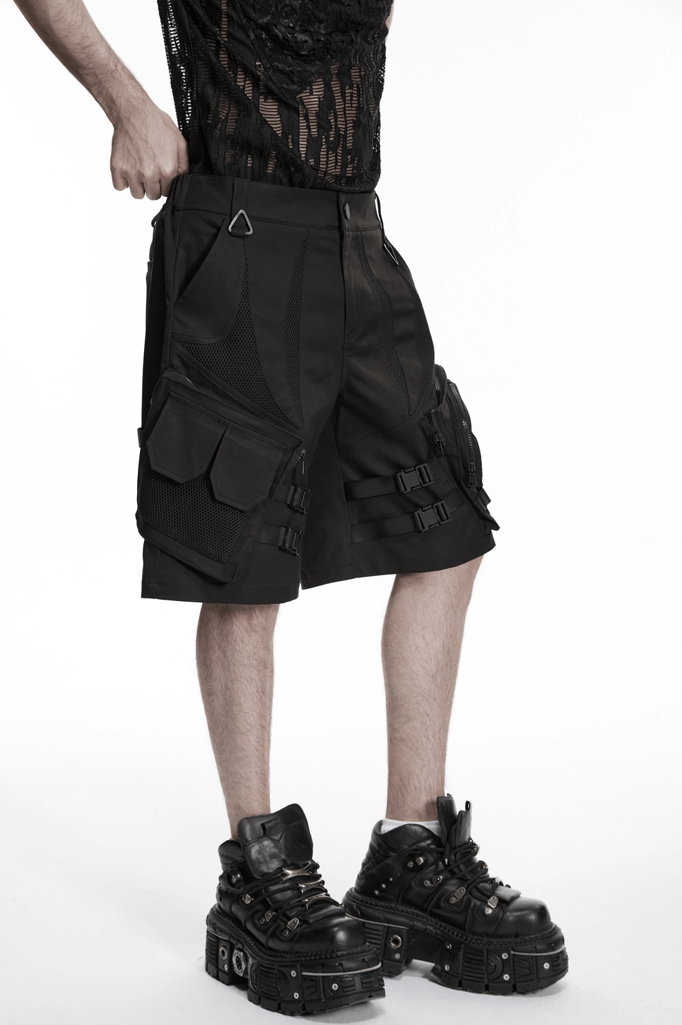 Lifestyle image of black gothic cargo shorts demonstrating volume and loose fit silhouette for layered styling