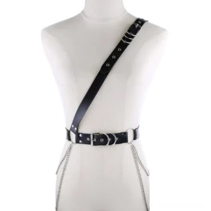 Black gothic one-shoulder chain harness belt with silver metal rings and adjustable buckles, front view on mannequin