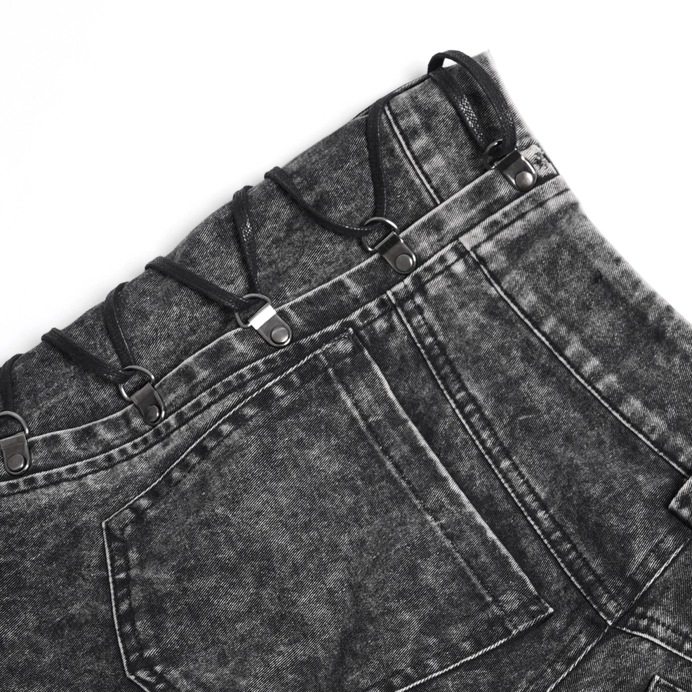 Black distressed gothic jeans back pocket close-up, side lace-up details and metal hardware, reinforced stitching and acid-wash texture