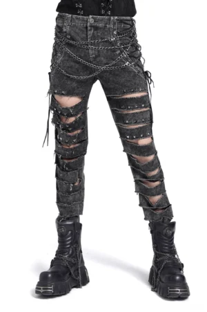 Black distressed gothic chain jeans front view on male model, acid-washed denim with extreme leg slashes and metal chain harness details, white studio background