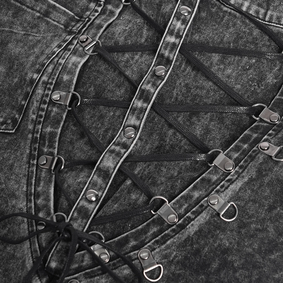 Black gothic chain denim jeans front detail view, ripped leg opening with acid-wash finish and metal stud trim, chain harness configuration