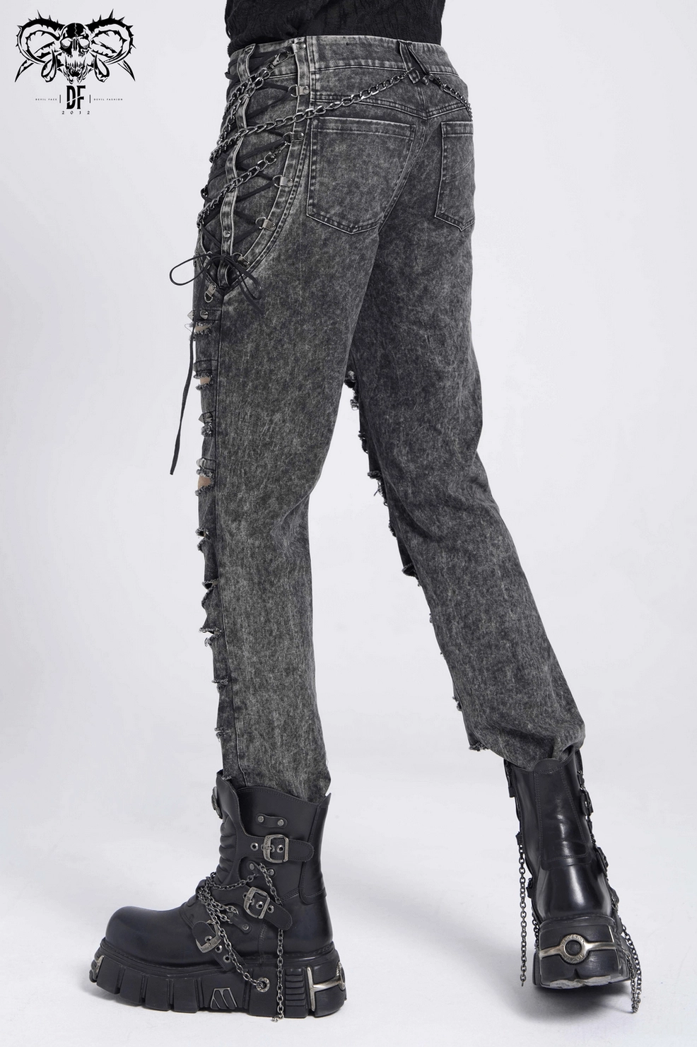 Black distressed gothic jeans side view, lace-up closure system with metal chains and extreme leg rips, alternative punk aesthetic details