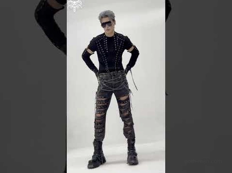 Male model wearing black distressed gothic chain jeans with complete dark aesthetic outfit, cyberpunk styling with sunglasses, grey studio background
