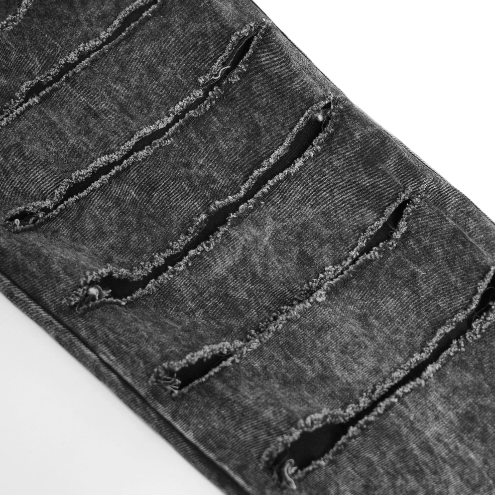 Black gothic chain jeans thigh rip detail, acid-washed denim with extreme slashing and reinforced edges, metal chain accents visible