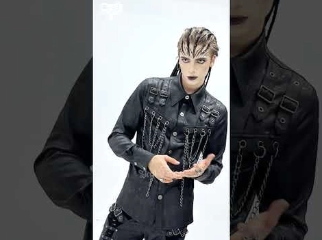 Black gothic chain buckle shirt fitted silhouette on male goth model against dark background, emphasizing metal hardware and industrial aesthetic