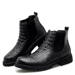 Black gothic crocodile embossed chelsea ankle boots with elastic side panels, three-quarter side view showing texture detail
