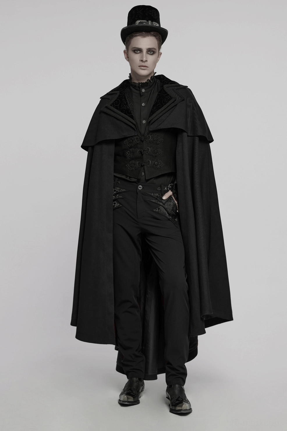 Black gothic velvet cloak highlighting satin lining interior and embossed velveteen texture from reverse angle