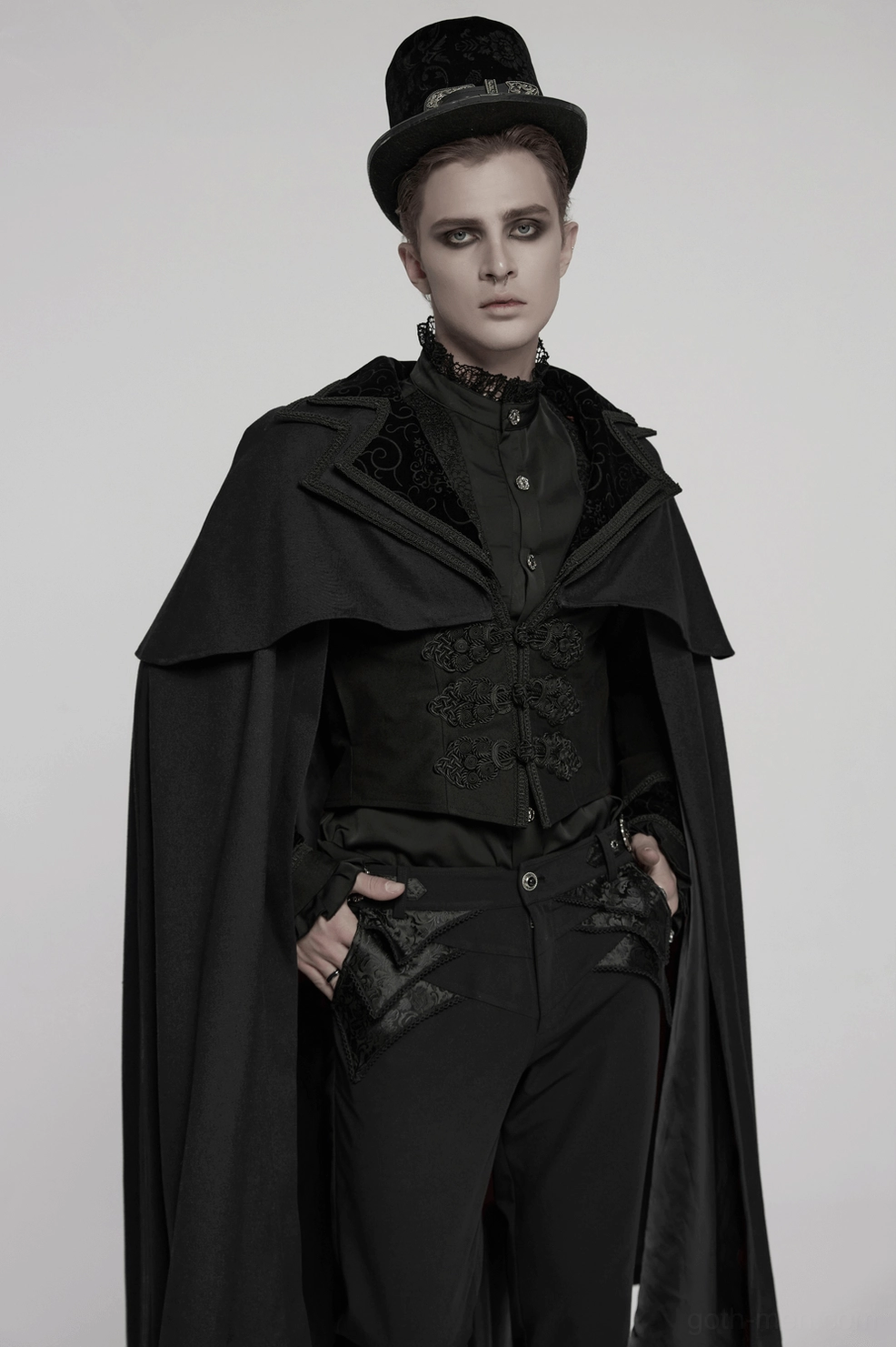 Detailed shot of black gothic vampire cloak showing wavy webbed collar edges and sophisticated button fastening system