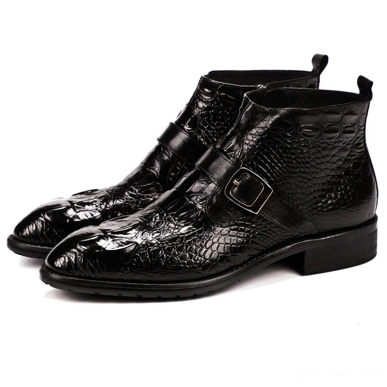 Black crocodile leather gothic chelsea boots with buckle strap and pointed toe, three-quarter view