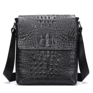 Black gothic crocodile leather shoulder bag with flap design and embossed logo, front view