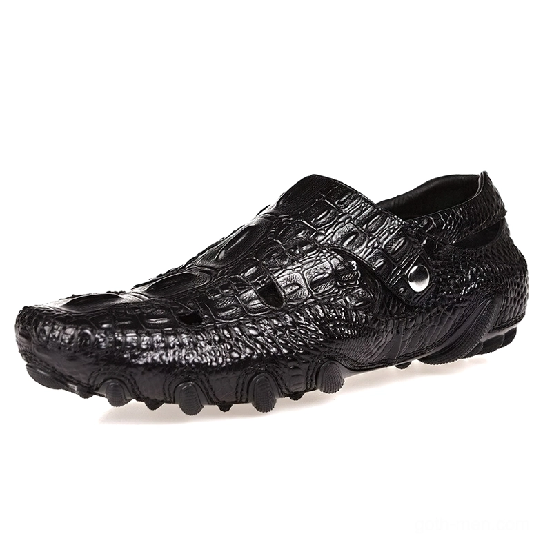 Black crocodile-embossed gothic leather loafers, front profile view displaying pure black genuine leather with metal accent strap and non-slip rubber sole