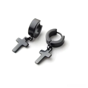 Matte black stainless steel cross dangle earrings flat lay - gothic huggie style pierced earring