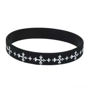 Black silicone mood tracker wristband with white cross pattern front flat lay