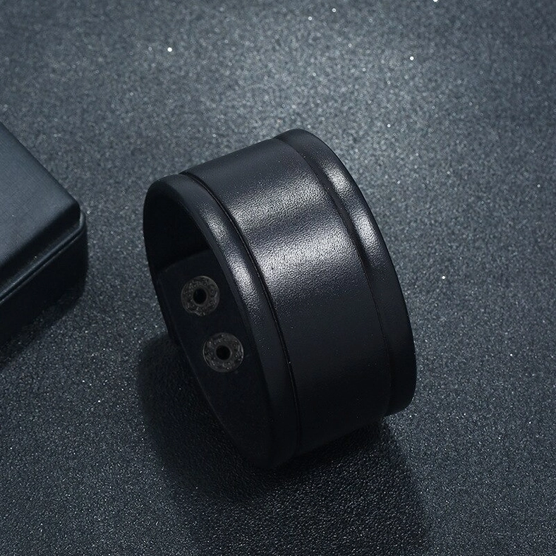 Black wide leather gothic cuff bracelet three-quarter side view showing inner snap button mechanism