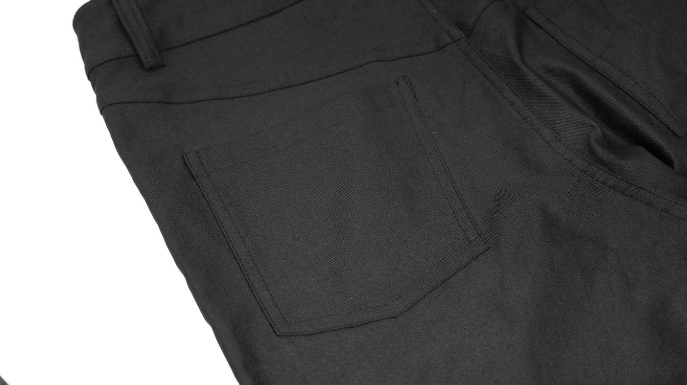 Back pocket detail of black woven gothic cyberpunk trousers