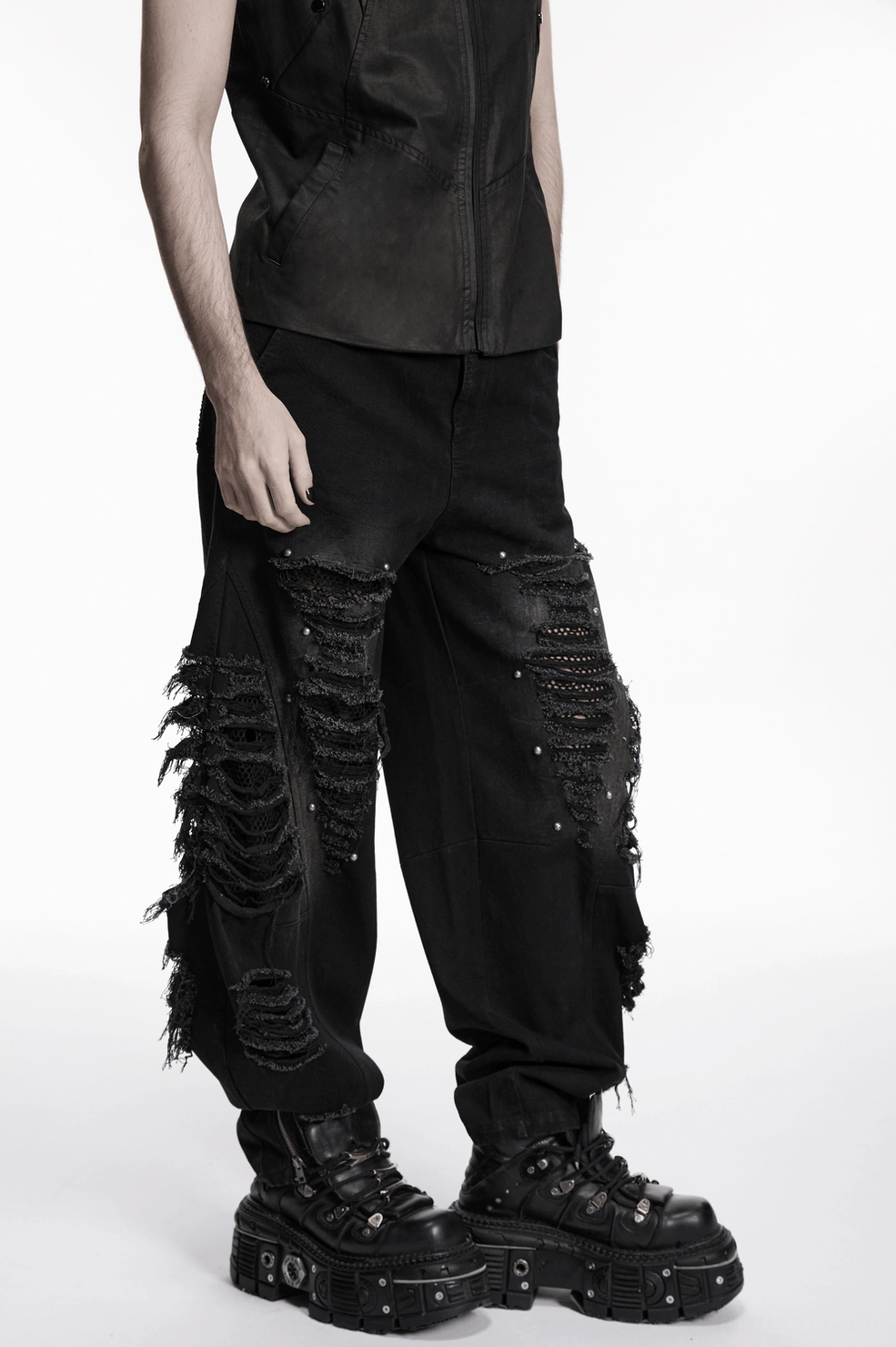 Black punk denim pants male model back view distressed rips and mesh underlayment