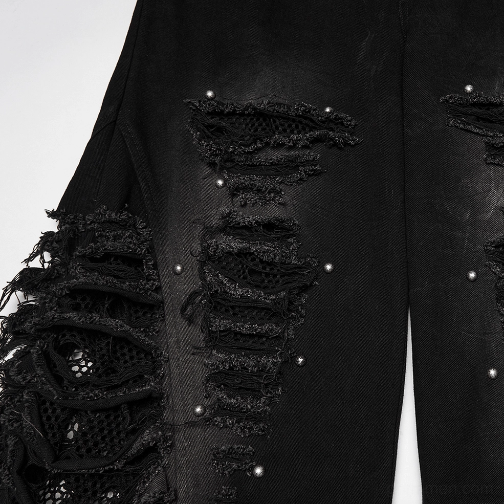 Close-up ripped denim panel detail metal studs frayed distressed mesh fabric texture