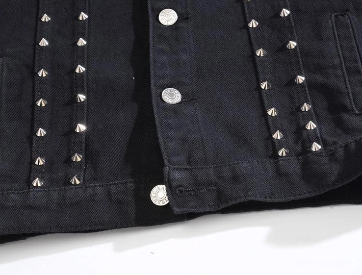 Front pocket and placket detail of gothic denim vest showing row of spike studs