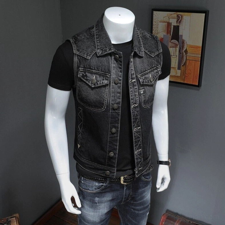 Three-quarter angle view of men's black gothic denim biker vest showing structured silhouette and slim fit