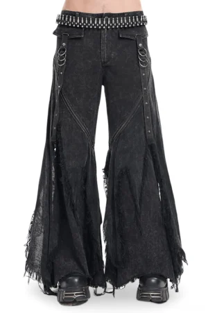 Front view of black gothic distressed flared jeans with metal D-ring straps and frayed edges, styled with platform boots