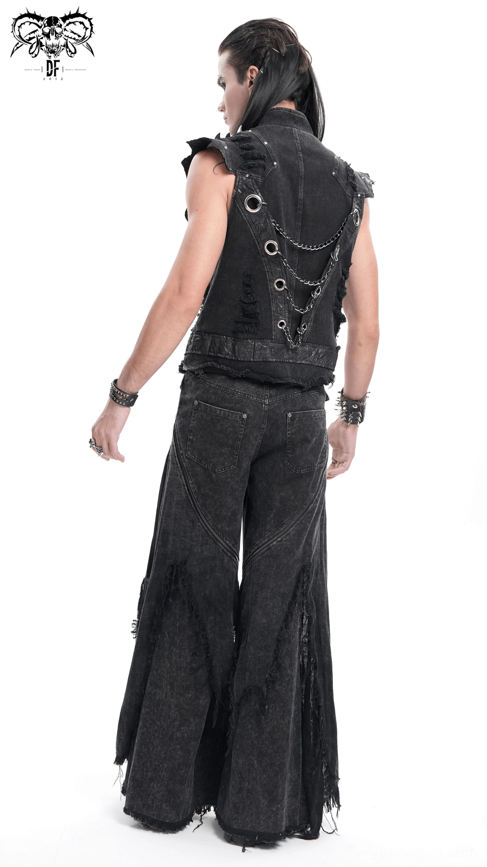 Leg opening detail of black gothic distressed flared jeans showing frayed hem and wide silhouette