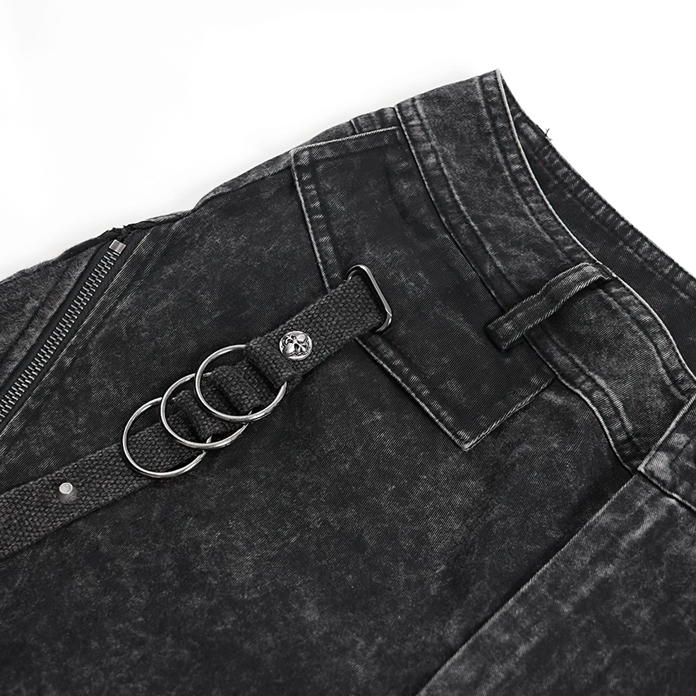 Close-up of triple D-ring metal hardware, rivet accents, and side zipper on gothic distressed jeans