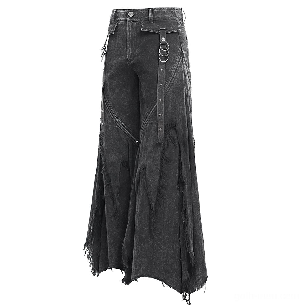 Close-up angled shot of black gothic jeans front with side metal D-ring strap, panel stitching, and frayed bottom hem